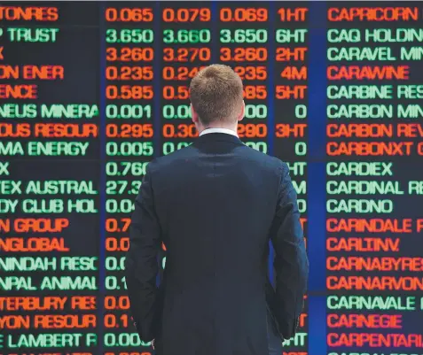  ?? Picture: AAP ?? SEEING RED: Digital market boards tell the story of yesterday’s plunge at the Australian Stock Exchange in Sydney,