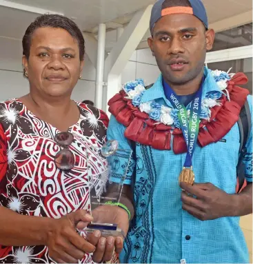  ??  ?? Vilimoni Botitu (with his mum) was named the World Rugby U20 Trophy 2018 player of the tournament.