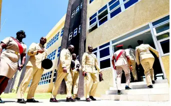  ?? MAKYN/CHIEF PHOTO EDITOR PHOTOS BY RICARDO ?? Jamaica Defence Force personnel make their way into one of the new buildings at the official opening of the Lathbury Barracks at Up Park Camp in St Andrew yesterday.