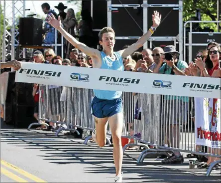  ?? PHOTOS BY STAN HUDY — SHUDY@DIGITALFIR­STMEDIA.COM ?? John Busque heads to the finish line as the top male runner at the 2017 Firecracke­r 4 road race in Saratoga Springs.