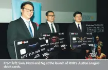  ??  ?? From left: Sien, Nazri and Ng at the launch of RHB’s Justice League debit cards.