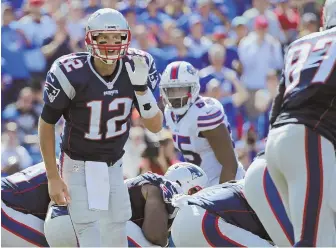  ?? AP PHOTO ?? CALL IT: Tom Brady can pick up his 14th win in Buffalo if the Patriots beat the Bills on Sunday.