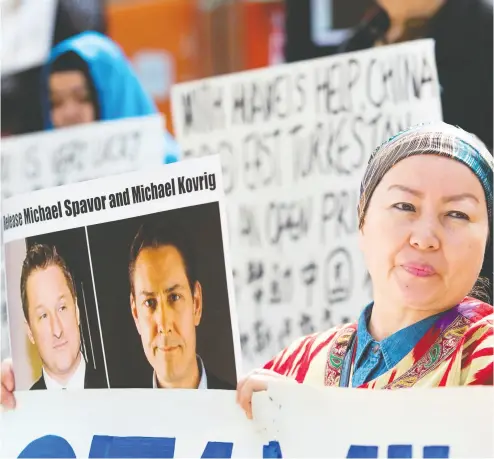  ?? JASON REDMOND / AFP / GETTY IMAGES FILES ?? China’s persecutio­n of its Muslim Uyghur minority and the detention of two Canadians — Michael Spavor and Michael Kovrig — have led many to call for Canada to take a tougher line on the economic powerhouse.