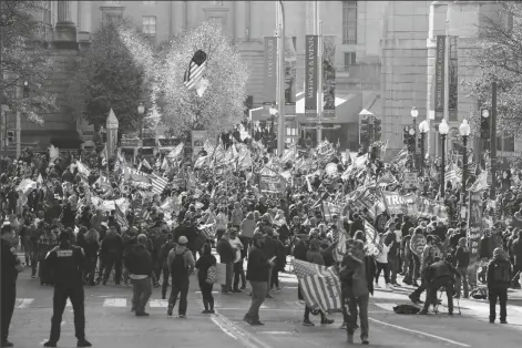  ?? ASSOCIATED PRESS ?? SUPPORTERS OF PRESIDENT DONALD TRUMP attend pro-Trump marches Saturday in Washington.