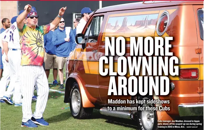  ?? | MORRY GASH/ AP ?? Cubs manager Joe Maddon, dressed in hippie garb, shows off his souped- up van during spring training in 2016 in Mesa, Ariz.