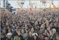  ?? PICTURE: YUI MOK/PA WIRE ?? Heaving crowds at a previous Glastonbur­y Festival. This year’s was to have been the 50th.