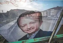  ?? AFP ?? A banner of Turkish President Recep Tayyip Erdogan flutters on a bridge above the Coruh river in Bayburt.