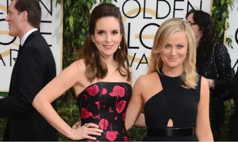  ?? JORDAN STRAUSS/INVISION/THE ASSOCIATED PRESS ?? A reader is missing three-time Golden Globes co-hosts Tina Fey, left and Amy Poehler during this awards season.