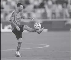  ?? Associated Press ?? Argentina’s Lionel Messi controls the ball during a training session, Monday, ahead of the team’s friendly match with UAE today, in Abu Dhabi, United Arab Emirates.