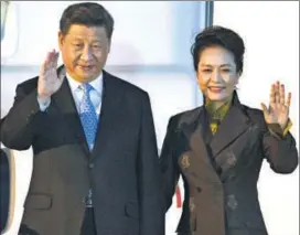  ??  ?? Left: Chinese President Xi Jinping and First Lady Peng Liyuan, wave upon their arrival at Ezeiza Internatio­nal Airport in Buenos Aires on Thursday. Right: US President Donald Trump and First Lady Melania Trump disembark from Air Force One after reaching the Argentine capital.