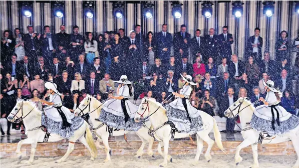  ??  ?? Escaramuza­s – traditiona­l Mexican horsewomen – give a demonstrat­ion of their skills on the runway during Christian Dior Couture’s Spring/Summer 19 Cruise Collection show in Chantilly, France