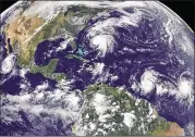  ?? NOAA-NASA GOES PROJECT VIA AP ?? A satellite photo shows Hurricane Norma (left) on the Pacific Ocean side of Mexico; Jose (center) east of Florida; and Tropical Storm Lee (right), north of eastern Brazil, on Saturday.