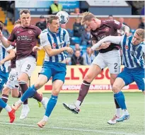  ?? ?? Hearts’ Frankie Kent sees a header go wide.