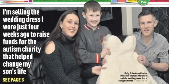  ?? STEPHEN HAMILTON ?? Kelly Roberts and Jordan McGeown with son Alexander and the wedding dress that is being auctioned