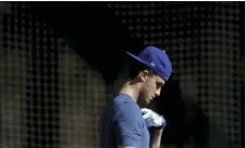  ?? GREGORY BULL — THE ASSOCIATED PRESS ?? The Dodgers’ Cody Bellinger leaves the batting cages on Friday in Phoenix.