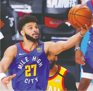  ?? KEVIN C. COX / GETTY IMAGES FILES ?? Jamal Murray of the Denver Nuggets is likely on the Team Canada wish list for Olympic qualifying, but whether
he'll be available depends on how deep he and the Nuggets go in next year's NBA playoffs.