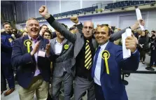  ?? Picture: Colin Mearns ?? Franny Scally, second right, Abdul Bostani, right, winning in the Maryhill ward for the SNP, with Bob Doris, left