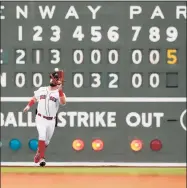  ?? Michael Dwyer / Associated Press ?? The Red Sox’s Kyle Schwarber makes the catch on a flyout by the Indians’ Austin Hedges during the ninth inning on Sunday in Boston.