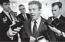  ?? J. SCOTT APPLEWHITE/AP ?? Sen. Rand Paul, R-Ky., answers questions Wednesday after threatenin­g to reveal the name of the whistleblo­wer.