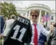  ?? ANDREW HARNIK — THE ASSOCIATED PRESS ?? Tim Dagit of Chester Springs, Pa. holds up an Philadelph­ia Eagles jersey for quarterbac­k Carson Wentz and an American flag during the “Celebratio­n of America” event on the South Lawn of the White House, Tuesday in Washington.