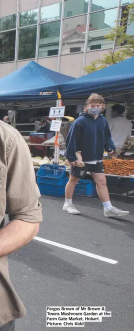  ?? ?? Fergus Brown of Mr Brown & Towns Mushroom Garden at the Farm Gate Market, Hobart. Picture: Chris Kidd