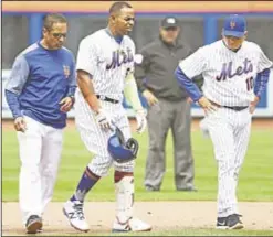  ??  ?? Yoenis Cespedes limps off field after hurting hamstring but Terry Collins (r.) says Mets can’t use injuries as an excuse.
