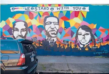  ?? TOJOANDRIA­NARIVO/THE NEWYORKTIM­ES ?? Oregon earmarked $62 million to benefit Black residents and business owners. Now some of the money is on hold after lawsuits alleging discrimina­tion. Above, a Black Lives Matter mural in Portland, Oregon.
