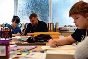  ?? ?? From left, hard at work in one of the classrooms, where class sizes are kept small; an alpaca on the school’s mini farm; and principal