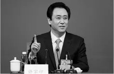  ??  ?? Evergrande Group chairman Xu Jiayin gestures during a press conference for the Fifth Session of the 12th CPPCC National Committee in Beijing, China in March. — Reuters photo