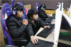  ?? GREG BAKER/AFP ?? Students practise computer games in an eSports class at the Lanxiang technical school on January 29 in Jinan, China.