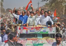  ?? — PTI ?? Congress leader Jyotiradit­ya Scindia with Kamal Nath and tribal leader Kantilal Bhuria take part in a roadshow before a public meeting ahead of Kolaras bypoll in Madhya Pradesh on Thursday.