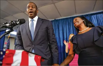  ?? PHOTOS BY JOE RAEDLE / GETTY IMAGES ?? Andrew Gillum, the Democratic nominee for governor, stands with his wife, R. Jai Gillum, on Friday in Orlando. His rise may be evidence that Democratic candidates are starting to more fully embrace their activist base.