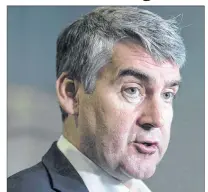  ?? CP PHOTO ?? Nova Scotia Premier Stephen McNeil talks with reporters at the legislatur­e in Halifax on Wednesday, May 31, 2017. McNeil says he fully intends to seek a third mandate as premier of the province.