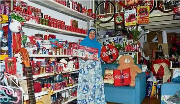  ??  ?? Doing her part: Siti Sariah at her charity shop in Danga City Mall, Johor Baru.