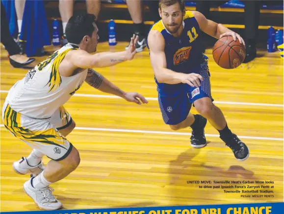  ?? Picture: WESLEY MONTS ?? UNITED MOVE: Townsville Heat’s Corban Wroe looks to drive past Ipswich Force’s Zarryon Feriti at
Townsville Basketball Stadium.