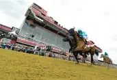  ?? KENNETH K. LAM/STAFF ?? John Velazquez, riding National Treasure, wins the 2023 Preakness at Pimlico Race Course in Baltimore on May 20.