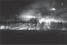  ??  ?? ROBERT LONGO confronts recent events in “Untitled (Ferguson Police, August 13, 2014).” It’ll be on view when the Broad opens.