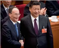  ?? AFP ?? Wang Qishan shakes hands with Xi Jinping after Wang was elected as China’s vice-president in Beijing on Saturday. —