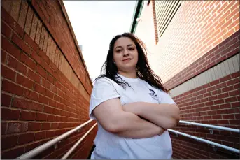  ?? (AP Photo/Chris Carlson) ?? Laura Comino, a senior at the University of North Carolina at Greensboro, poses for a picture July 14 in Charlotte, N.C. College students are getting ready to return to school in August as the country deals with the coronaviru­s pandemic. More and more campuses are sparking frustratio­n by releasing plans to keep students’ housing payments, even if the campuses shut down again and go entirely online in the fall.