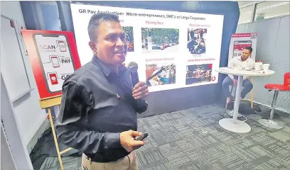  ?? Picture: ELIKI NUKUTABU ?? Vodafone’s Shailendra Prasad presents the features of the M-PAiSA QR applicatio­n during its launch in Suva.