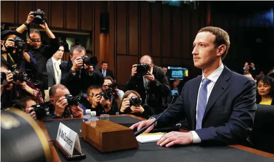  ?? Tom Brenner / New York Times ?? Mark Zuckerberg, chief executive of Facebook, testifies to the Senate inside the Hart Hearing Room in Washington, April 10, 2018.