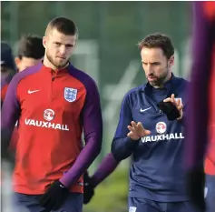  ?? AFP ?? England manager Gareth Southgate, right, shares a few words with midfielder Eric Dier ahead of training yesterday