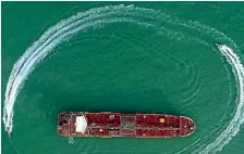  ?? AP ?? Speedboats from Iran’s Revolution­ary Guard circle the Britishfla­gged oil tanker Stena Impero.