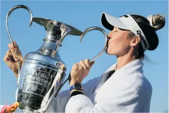  ?? ?? Nelly Korda celebrates with the trophy after winning the Chevron Championsh­ip at Carlton Woods on 21 April in The Woodlands, Texas. Photo: Andy Lyons/getty Images