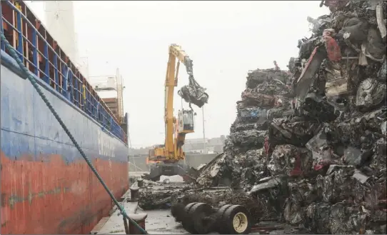  ??  ?? Scrap Cars being loaded onto a ship at Dundalk Docks. Photo: Aidan Dullaghan/Newspics.