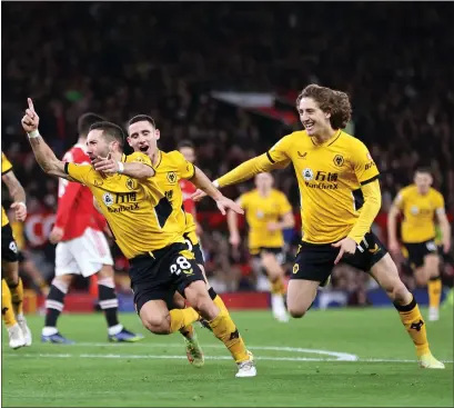  ?? ?? Joao Moutinho celebrates with Daniel Podence and Fabio Silva after scoring the winning goal