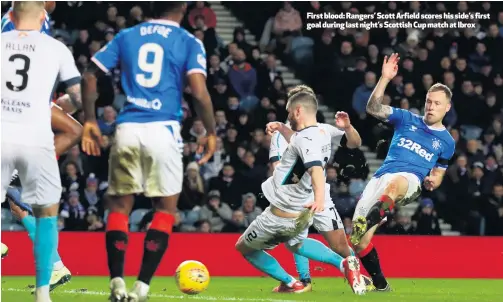  ??  ?? First blood: Rangers’ Scott Arfield scores his side’s first goal during last night’s Scottish Cup match at Ibrox