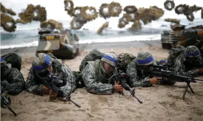  ??  ?? South Korean marines take part in a US-South Korea joint landing operation drill. Details of joint military drills were believed to be among documents hacked by North Korea. Photograph: Kim Hong-Ji/Reuters