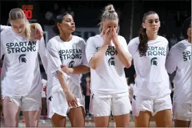  ?? AL GOLDIS — THE ASSOCIATED PRESS ?? Michigan State players including Stephanie Visscher, from left, Moira Joiner, Theryn Hallock and Abbey Kimball stand together before an NCAA college basketball game against Maryland, Saturday, Feb. 18, 2023, in East Lansing, Mich.