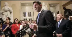  ?? AP PHOTO/J. SCOTT APPLEWHITE ?? Speaker of the House Paul Ryan, R-Wis., joined at right by House Ways and Means Committee Chairman Kevin Brady, R-Texas, meets reporters just after passing the Republican tax reform bill in the House of Representa­tives on Capitol Hill in Washington on...